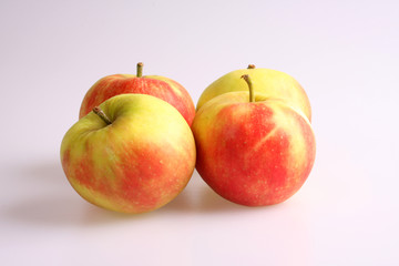 A studio photograph of apples against a white background