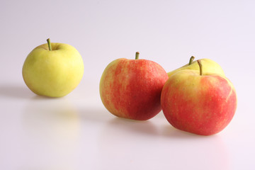 A studio photograph of apples against a white background