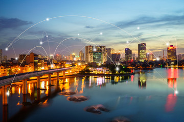 Obraz premium Smart city and wireless communication network concept. Digital network connection lines of Hanoi at Hoang Cau lake