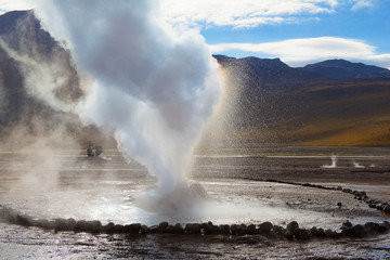 Geyser at the El Tatio geothermal field at sunrise, Chile.