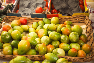 green salad tomatoes at a market stall