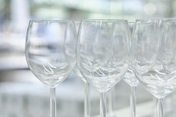 Modern glass goblets standing nearby.