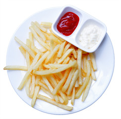 Unhealthy French fries,fried potatoeson whit dish with tomato suce