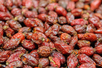 Background and texture of dry rose hips.