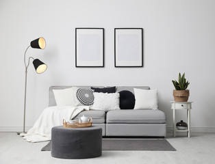 Stylish living room interior with comfortable sofa