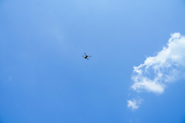 Fototapeta premium Drone flying over blue sky, take photo and video