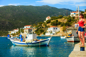 Fototapeta na wymiar Tourist woman in greek marina