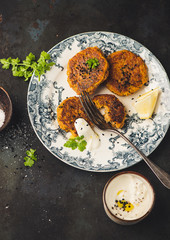Vegetarian food. Vegetable cutlet from carrot, zucchini, potato with sauce.