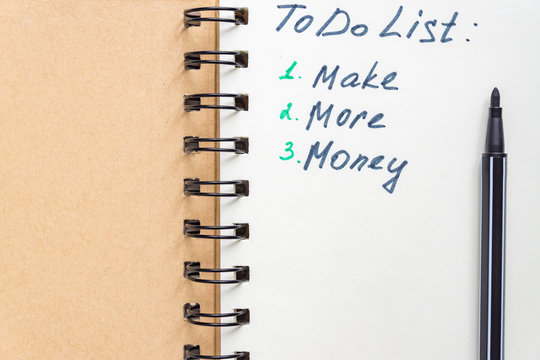 To do list - make more monTo do list - make more money written text on note pad. Close upe written text on note pad.