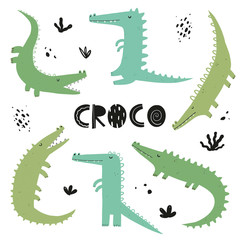 Obraz premium Vector hand-drawn color children's simple flat set with crocodiles in Scandinavian style on a white background. Baby crocodiles on a white background. Cute animals. Reptile. Set of crocodiles. 