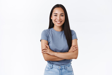 Success, beauty and lifestyle concept. Attractive asian girl in t-shirt, cross hands chest in determined, confident pose, smiling enthusiastic, feeling optimistic and assertive, white background