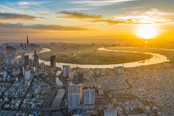 Amazing aerial view of Saigon cityscape under sunset sky 