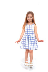 Fototapeta premium Shot of a young smiling girl with long blonde hair against white background with copy space in studio