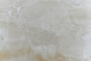 Natural beige polished marble with sharp and blurry stripes. 