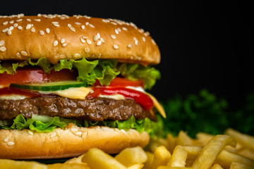 Juicy beef burger with cutlet, onion, vegetables.Isolated hamburger