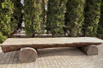 Wooden benches installed in a park area, background