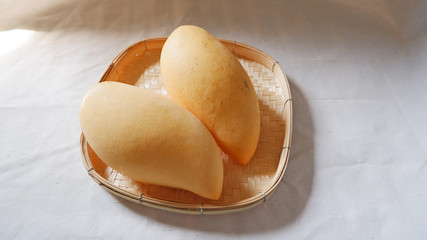 Minimal Yellow mango Fruit on basket