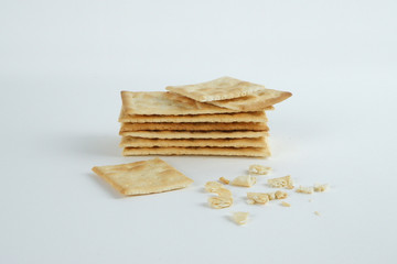 Dry cracker close up on white background