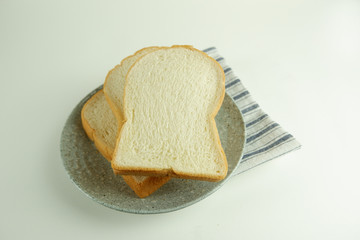 Top view slices of bread on white background