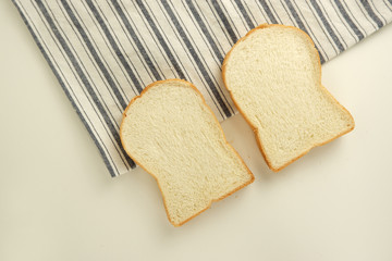 Top view slices of bread on white background
