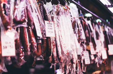 Spanish sausages in barcelona market,  traditional national spain meat in store,  chorizo food on background gastronomy