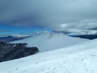Fototapeta na wymiar Winter mountain landscape with clouds