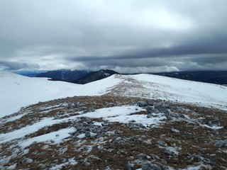 Winter mountain landscape with clouds