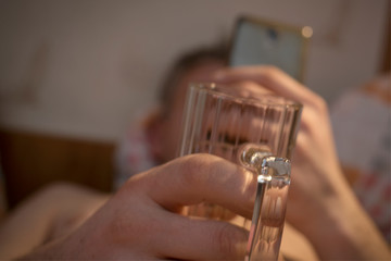 hands of man with glass of beer