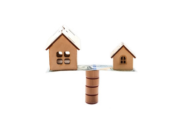 Financial growth concept, real estate tax, buying and selling houses, insurance. Small houses on a...