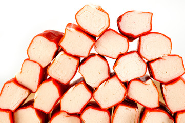 Frozen crab sticks shot on a light background. Background for food and ingredients.