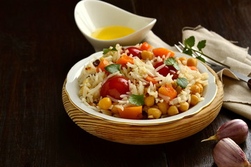 Rice with pumpkin, chickpeas and cherry, copy space