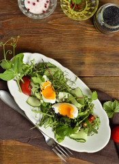 Cucumber, tomato, egg, fresh green salad with black sesame, vertical, top view, copy space