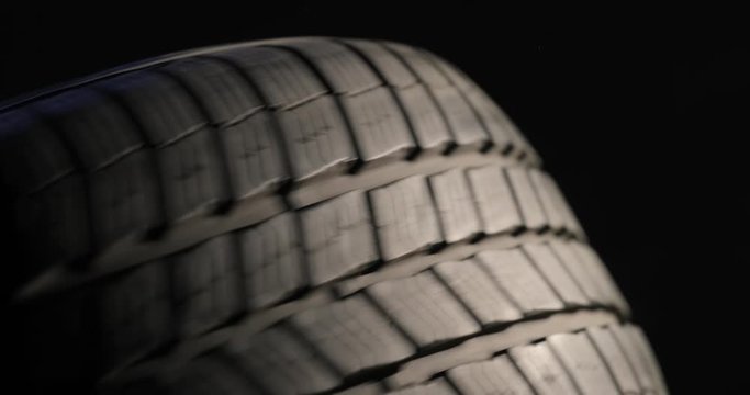 Spinning Tire Of A Car, Slowing Down Slowly Coming To A Stop, Or Slowly Staring To Roll If You Reverse The Footage