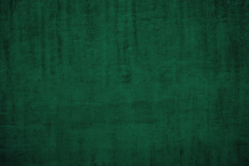 The texture of the soft green fabric. Dark tender green fabric background
