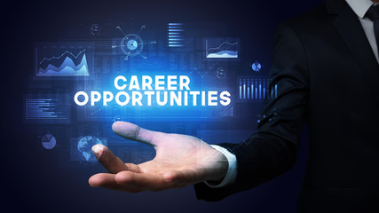 Hand of Businessman holding CAREER OPPORTUNITIES inscription, business success concept