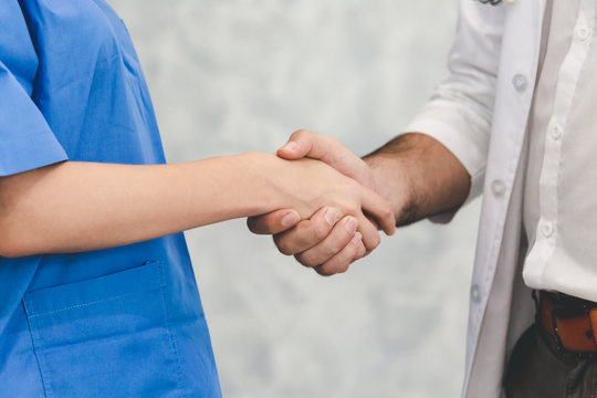 Doctor and nurse handshake