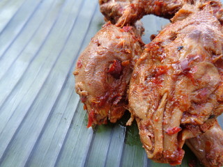 Spicy grilled quail's egg (telur bakar pedas) on banana leaves. Indonesian cuisine street food.