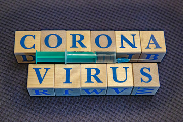 Wooden cubes with word Coronavirus in blue letters