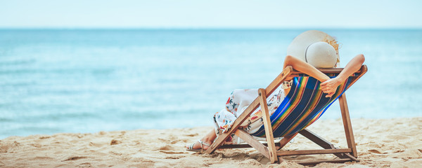 Woman on beach in summer - obrazy, fototapety, plakaty