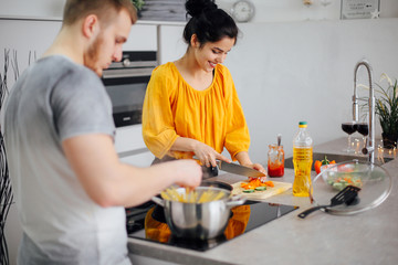 Ppeople cooking pasta. Happy family having spaghetti dinner
