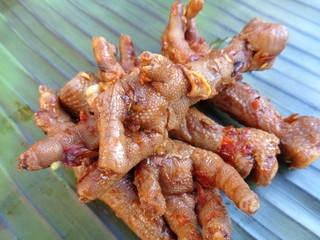 Spicy grilled quail's egg (telur bakar pedas) on banana leaves. Indonesian cuisine street food.
