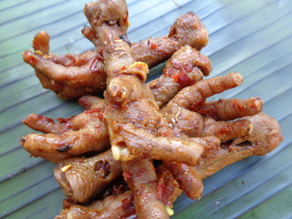 Spicy grilled quail's egg (telur bakar pedas) on banana leaves. Indonesian cuisine street food.