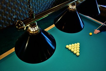 Pool table with balls in the form of a triangle