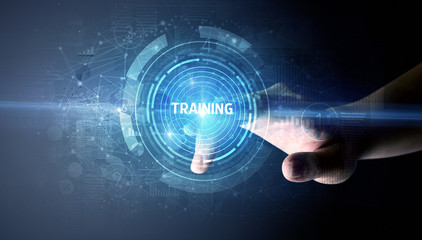 Hand touching TRAINING button, modern business technology concept