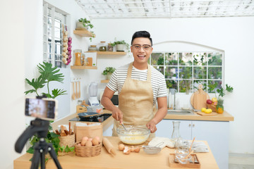 food blogger streaming live. man communicating with subscribers through phone camera