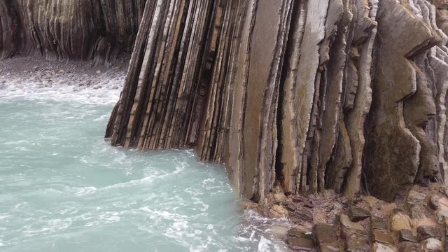 Coastal shot of Zumaia&rsquo;s flysch where the rough seas and huge cliffs surround the scenery.