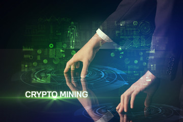 Businessman touching huge display with CRYPTO MINING inscription, modern technology concept