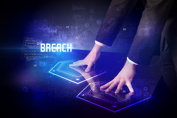 Hand touching digital table with BREACH inscription, new age security concept