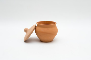 the unpainted ceramic pot with uncovered lid