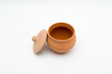 the unpainted ceramic pot with uncovered lid